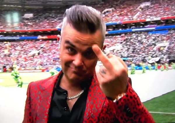 Remember? Robbie Williams  opening performance, he puts his middle finger at the opening ceremony of the Russian World Cup
